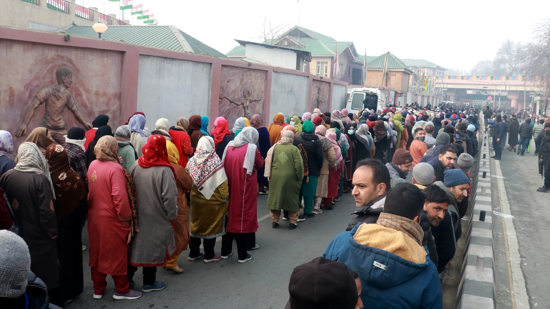 Members of public line up outside the Bakshi stadium in Srinagar to watch the Republic Day parade on Friday. Mubashir Khan for Greater Kashmir